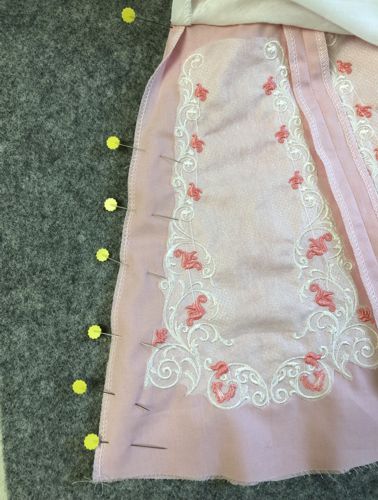 Finish the raw edges of the skirt and overlay together.
