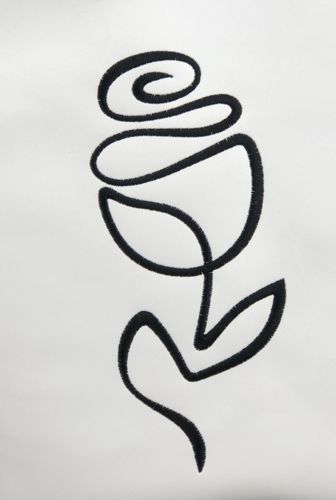 A close-up of the stitch-out on white faux leather.