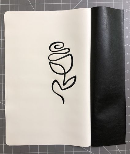 Sew the black 4" x 15 1/2" strip to the right edge of the white panel.