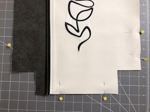 On the lower edge of both panels, cut out 2 1/2" x 2 1/2" squares at the corners.