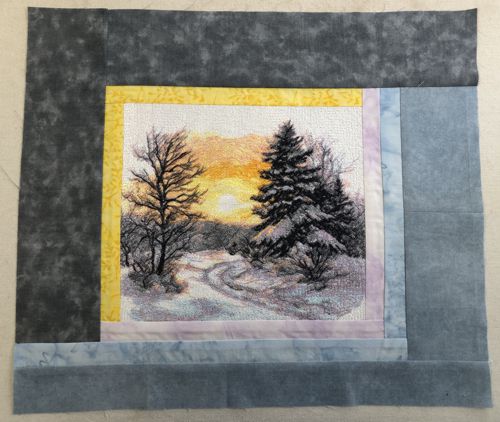 A light gray strip is attached to the bottom edge of the working piece.