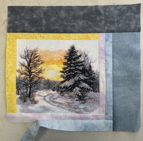 A dark gray strip is attached to the upper edge of the piece.