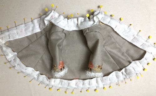 Pin the faux fur strip to the edges around.