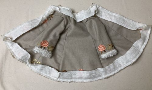 Stitch the strip to the coat.