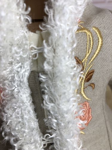 Sew 2 hook and loop closures to the wrong side of the fronts.