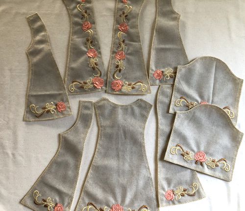 All parts of the coat are embroidered and cut-out.