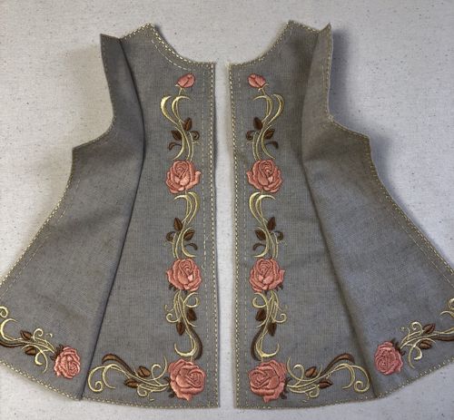 Front sides stitched to the fronts of the coat.