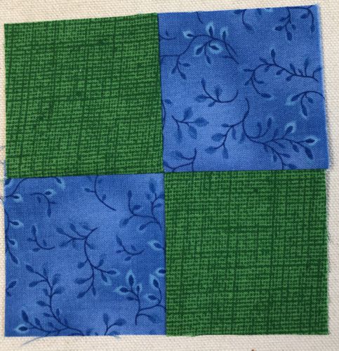 The strips are stitched into 4-patch squares.