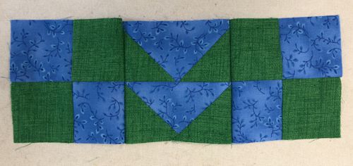 The 4-patch blocks stitched to the flying geese block.