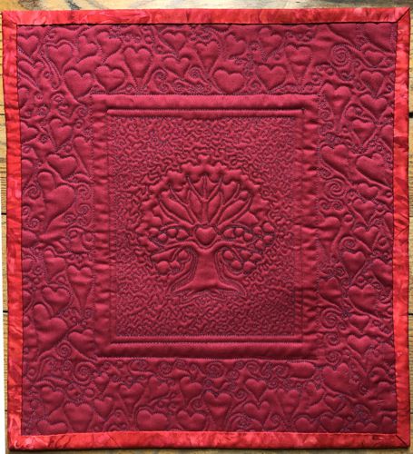 The back side of the quilt showing the quilting stitches.