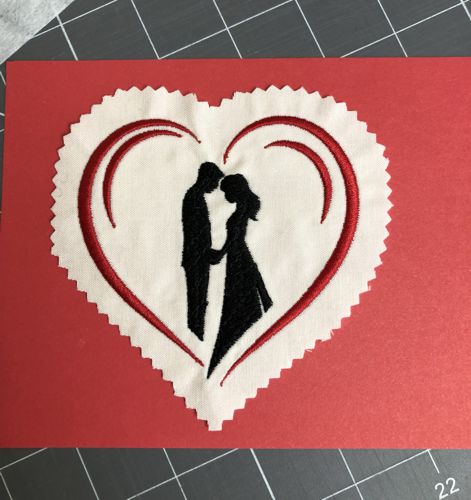 A stitch-out is permanently adhered to the paper.