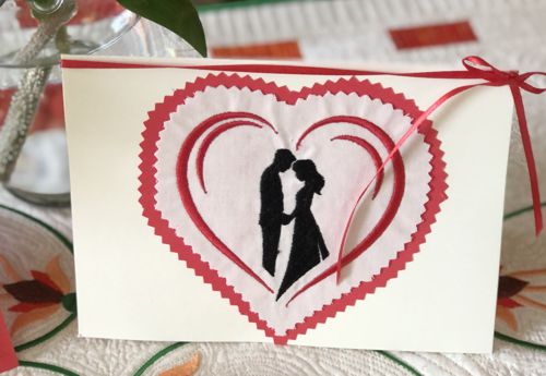 A finished Valentine card with heart-shaped stitch-out.
