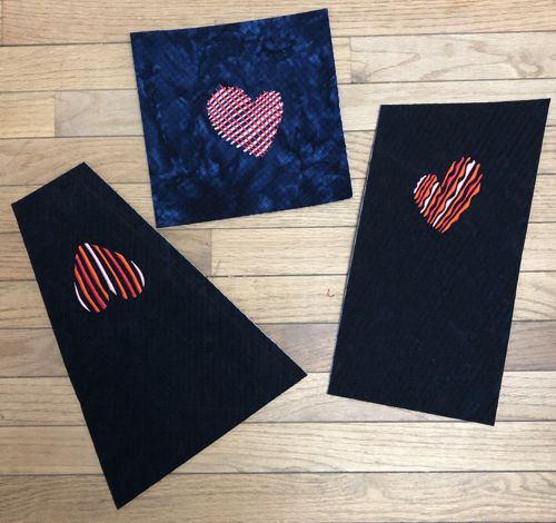 3 unfinished mug rugs with heart embroidery.