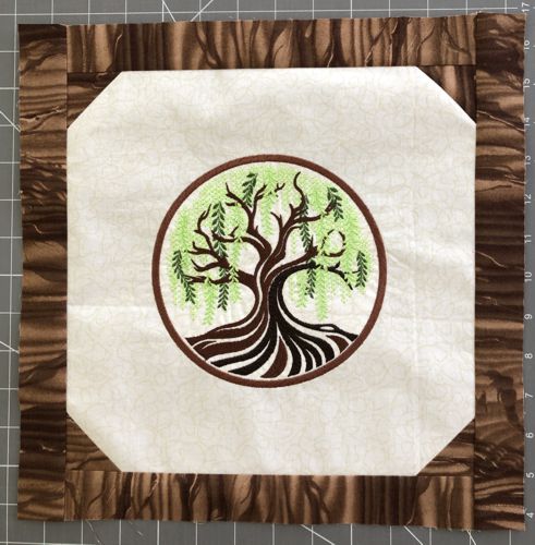 First, brown, border stitched to the central part.