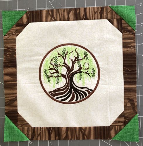 The green corners pressed open. Photo shows all four corners on the working piece.